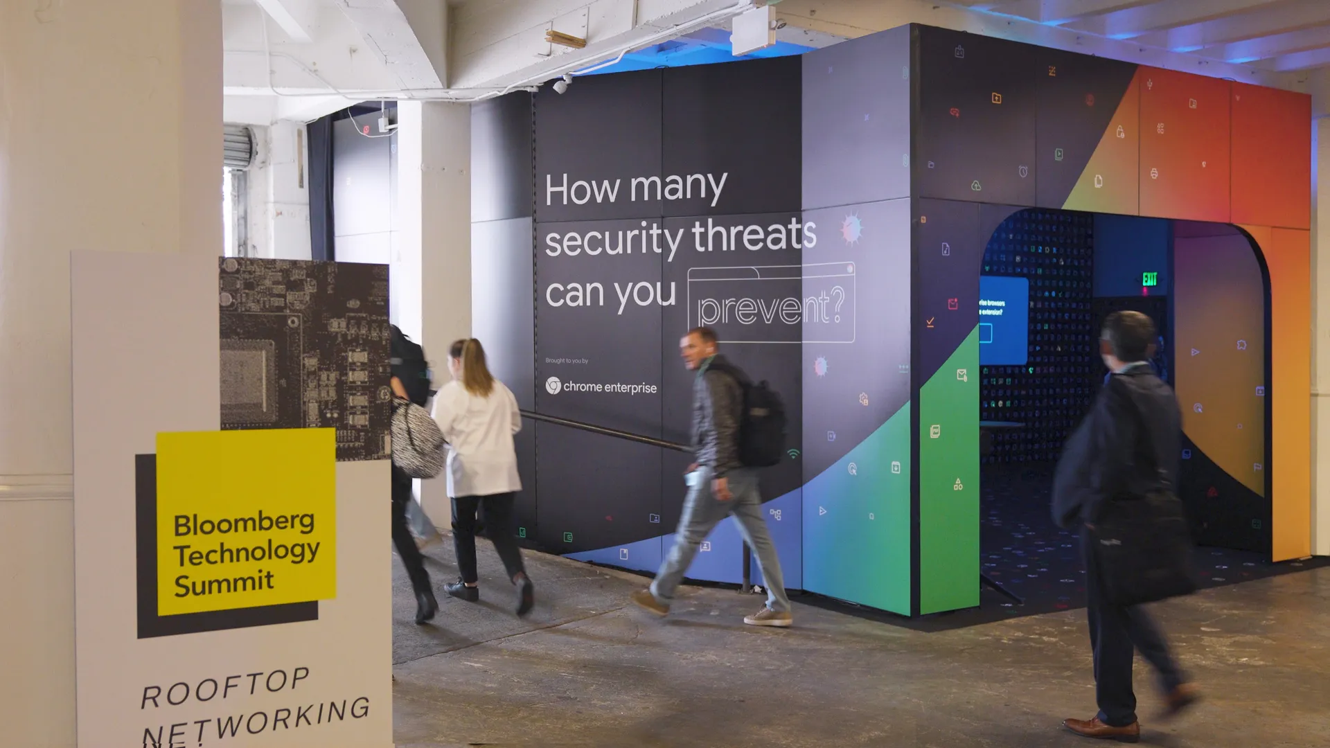 The outside of the Data Defense installation at the Bloomberg Tech Summit in 2023 displayed vibrant colors and invited attendees to play the game with the slogan: How many security threats can you prevent?